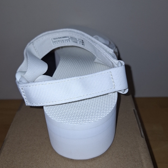 A pair of Teva W. Flatform Universal sandals in solid white in a ladies Size 9. - Picture 6 of 10
